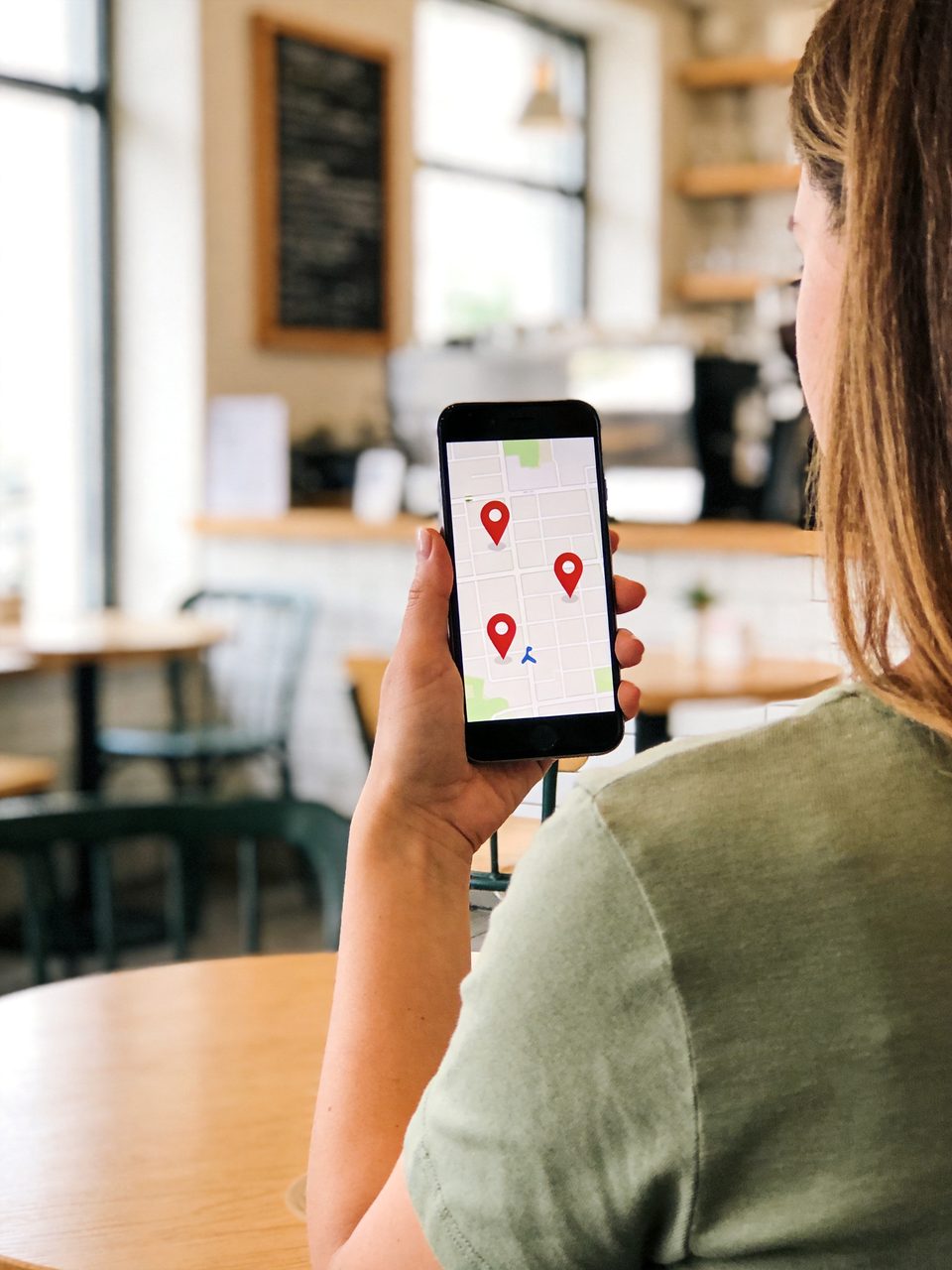 Patient searching for nearby clinics on a map on her phone