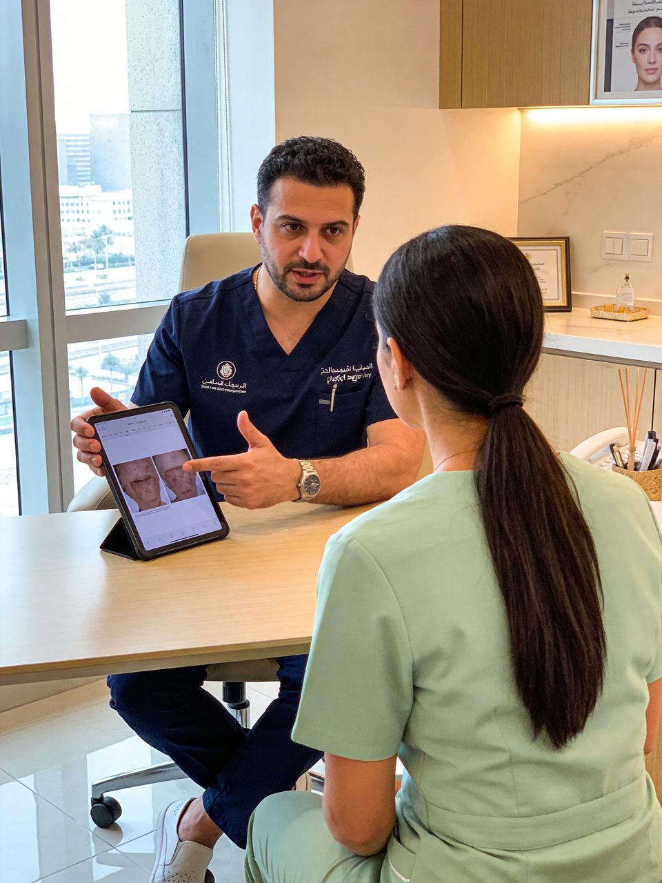 Plastic surgeon explaining a consultation to a patient